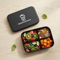 Lunch box bento noire flat lay avec repas sain